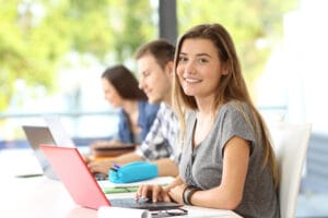 Happy student posing in a classroom