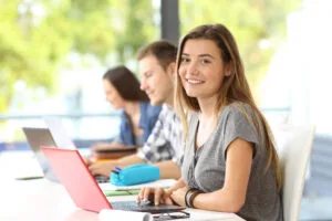 Happy student posing in a classroom